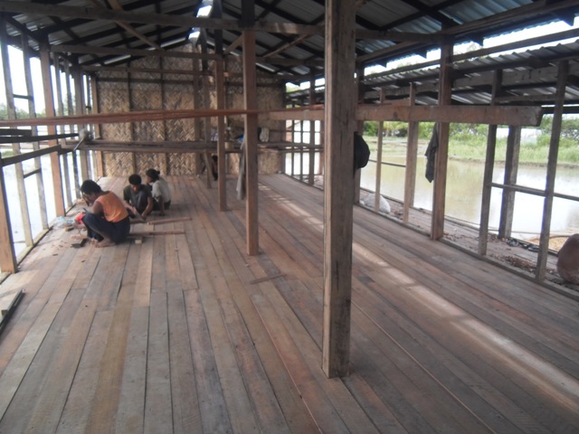 Construction workers building a new school in Burma